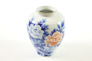 Japanese porcelain piece with a blue and white design, highlighted by gold trim