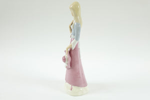 European Porcelain Figurine of a Girl